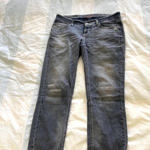 Distressed grey jeans